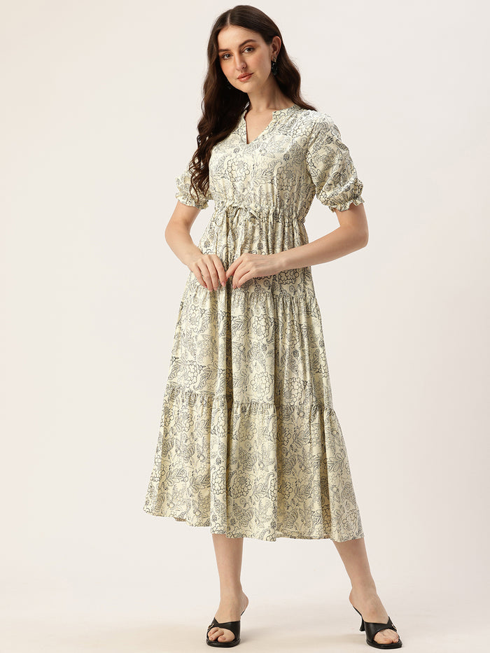 A woman modeling a beige and black floral printed fit & flare midi dress with a square neckline and short sleeves. Beige & Black Floral Printed Waist Tie-Up Fit & Flare Midi Dress, midi dress, dress, women’s western wear, party wear dress, casual wear dress