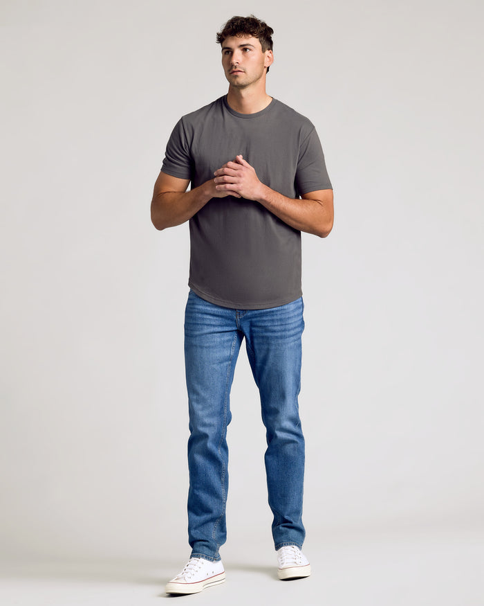 Young man wearing Carbon Short Sleeve Tall Curved Hem Crew.