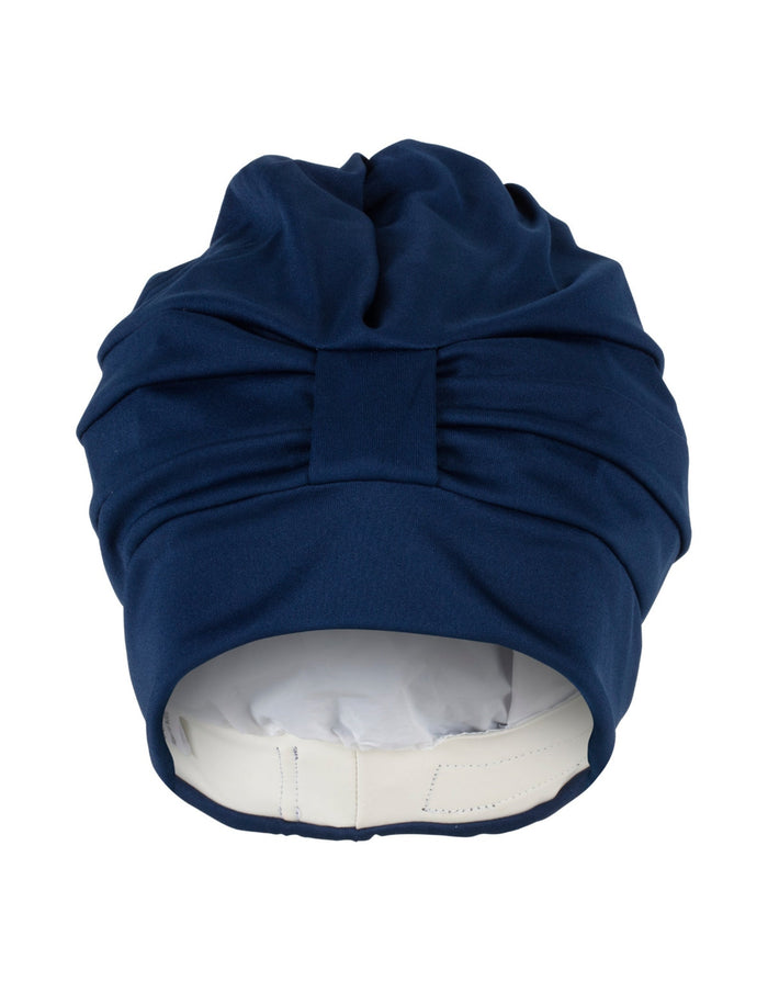 Navy blue draped fabric swim cap with satin bonnet, white lining, bow
