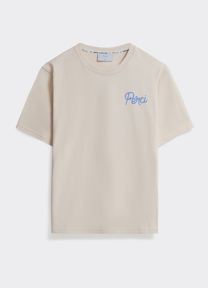 The Percival Hills T-Shirt in off white, a soft jersey crew neck with a blue script logo on the chest, shown flat.