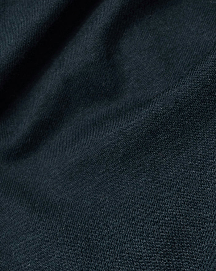 Navy Tall Short Sleeve V-Neck close-up of knit fabric texture.