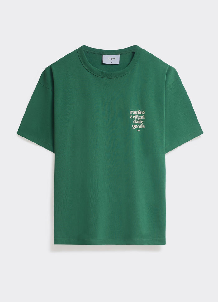 The green Percival Routine T-shirt in soft jersey, featuring a white 'routine' chest graphic, shown flat in a studio shot.