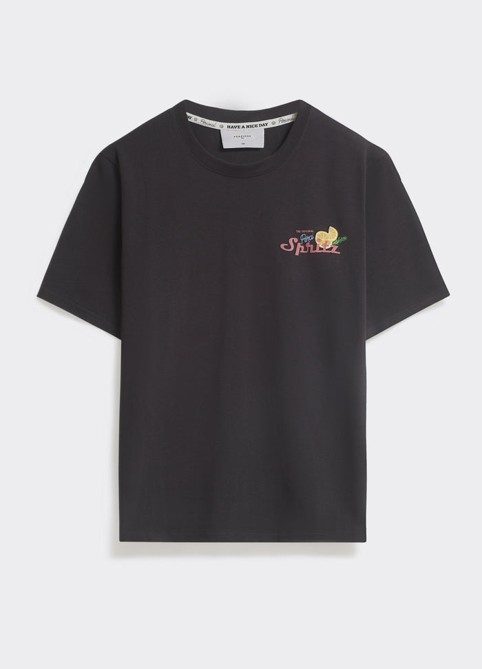 The Percival Spritz T-shirt in washed black, a midweight jersey crew neck with a colourful chest graphic, shown flat.