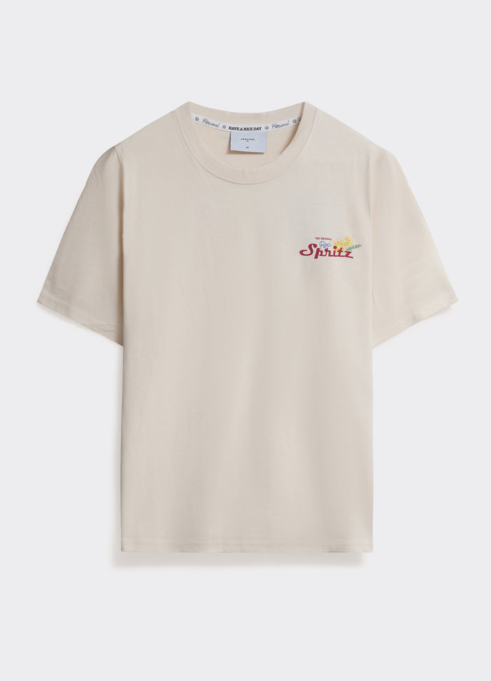 The Percival Spritz T Shirt in off-white jersey, featuring a small chest graphic and crew neck, shown flat.