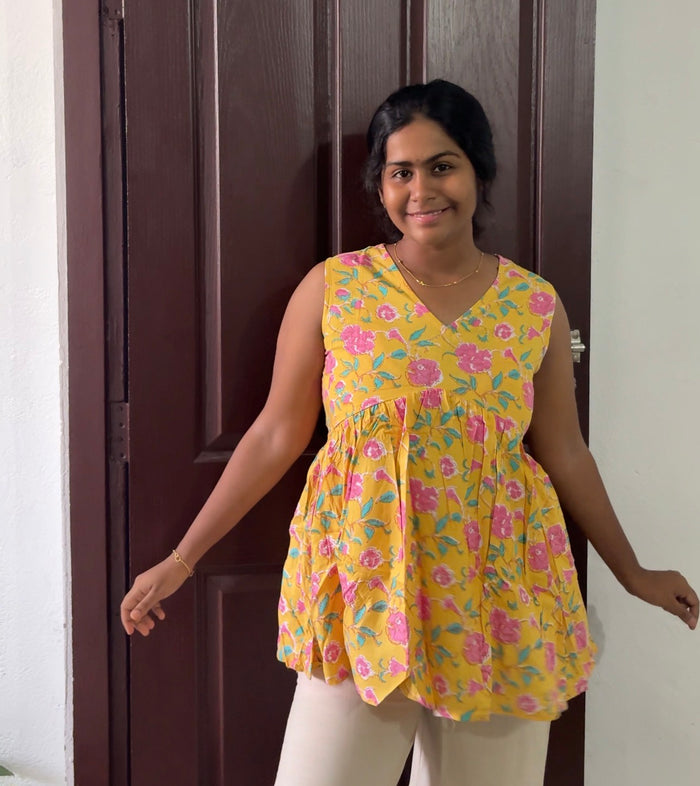 Yellow floral sleeveless Peplum Top