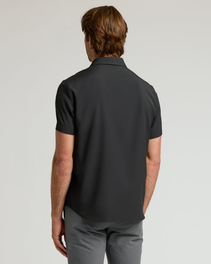 Back view of man in All Black Short Sleeve Performance Dress Shirt.