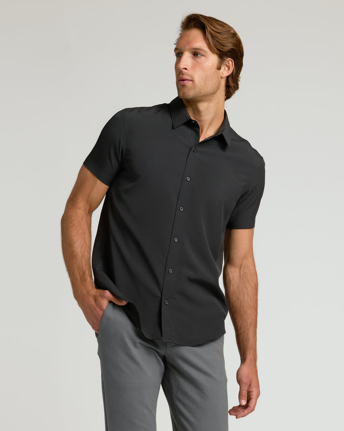 Man wearing All Black Short Sleeve Performance Dress Shirt, relaxed fit.