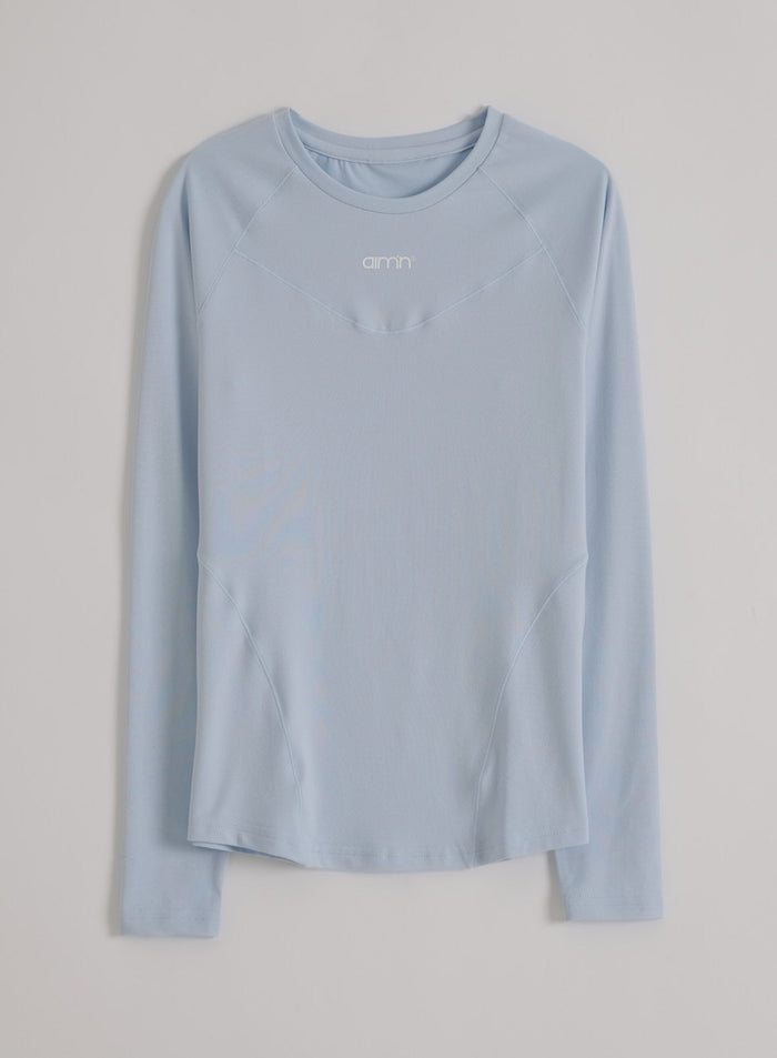 Light blue aim'n Soft Basic Long Sleeve featuring raglan sleeves and a second skin feel. [S-174cm]