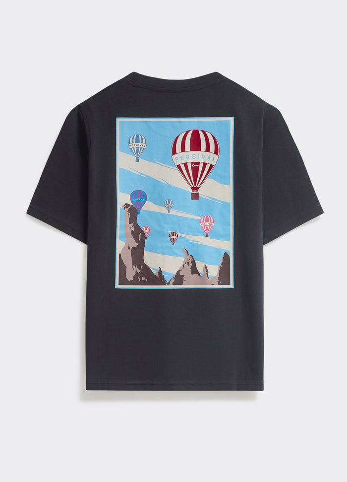 The Percival Balloon T-shirt in washed black jersey, featuring a large hot air balloon landscape graphic on the back.