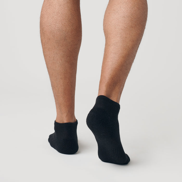 Black Ankle Socks 3-Pack on feet, showcasing seamless heel design.