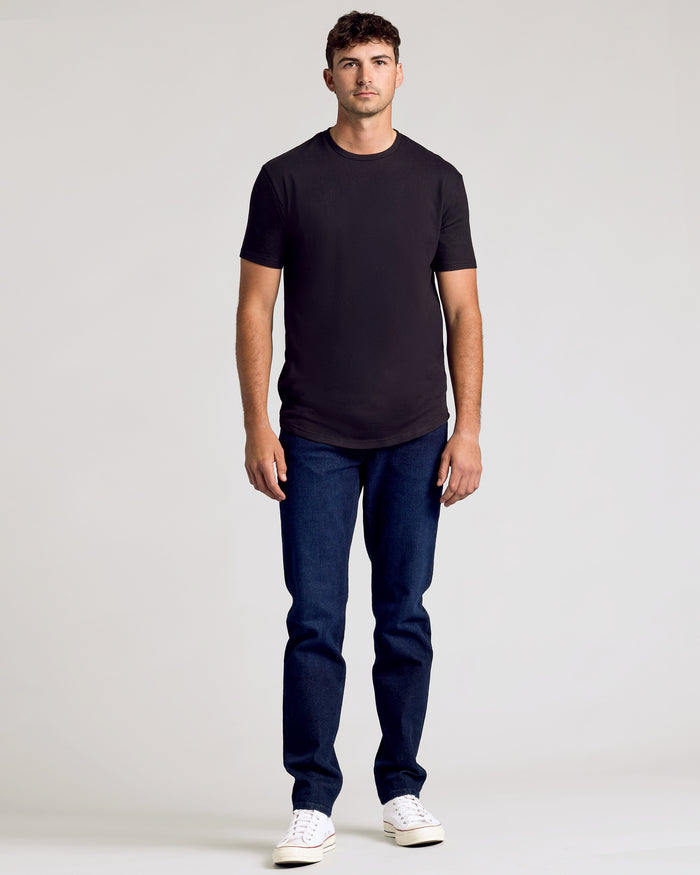 Black Classic Tall Curved Hem Crew 10-Pack worn by man, showcasing fit.