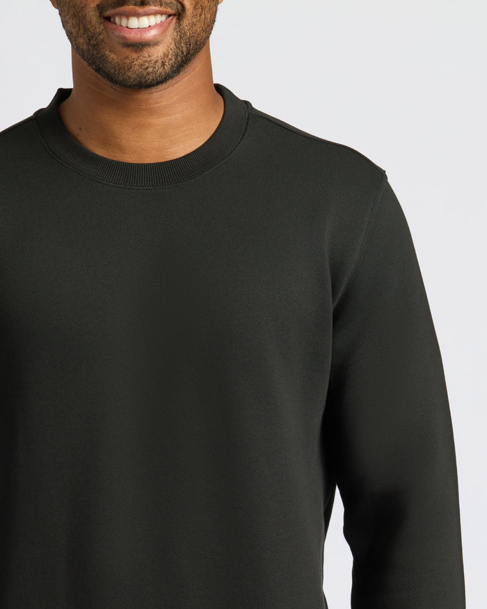 Man wearing Black Fleece French Terry Pullover Crew Neck sweatshirt.