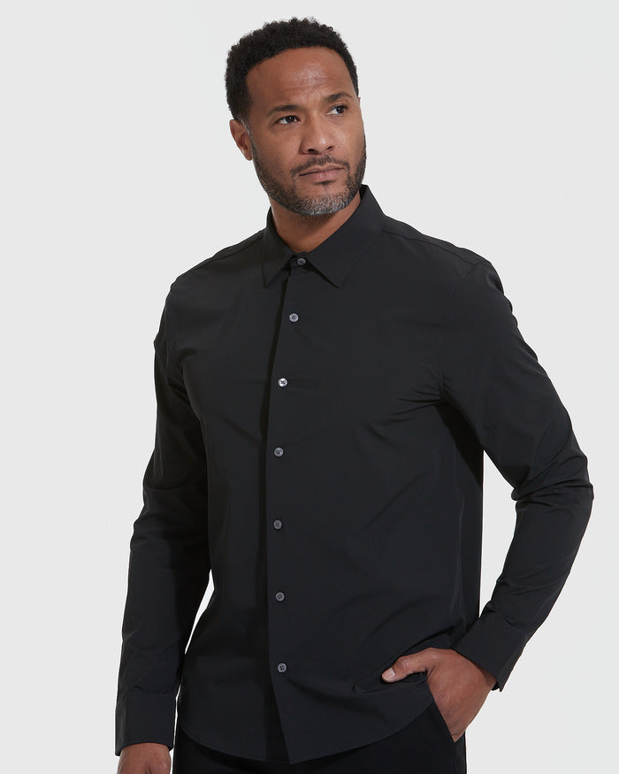 Black Lightweight Dress Shirt on man, hand in pocket, gray background.