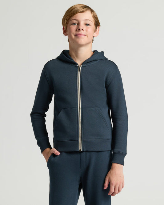 Teen boy wearing Boys' Navy Fleece Full Zip Hoodie.