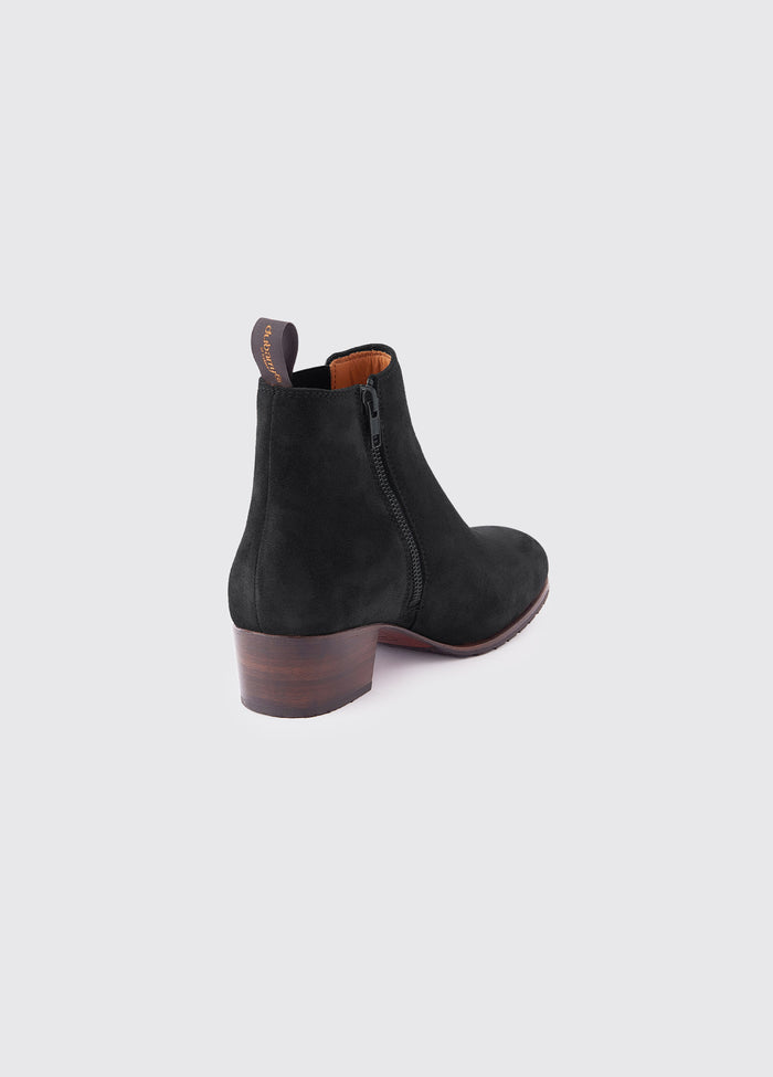Angled back view of a single Dubarry Bray Chelsea Boot for women, Black Suede coloured leather with elasticated side gussets with front and heel finger pulls