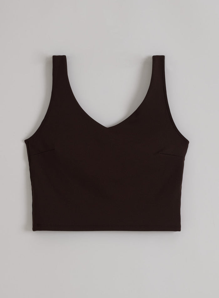 Chocolate brown aim'n Sense Bralette flat lay, showing the V-neckline and wide straps.