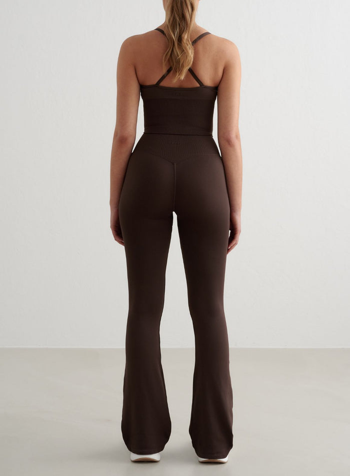 Chocolate brown aim'n Shape Seamless Flare Tights with a high waist and flared legs, shown from behind. [S - 175 cm]