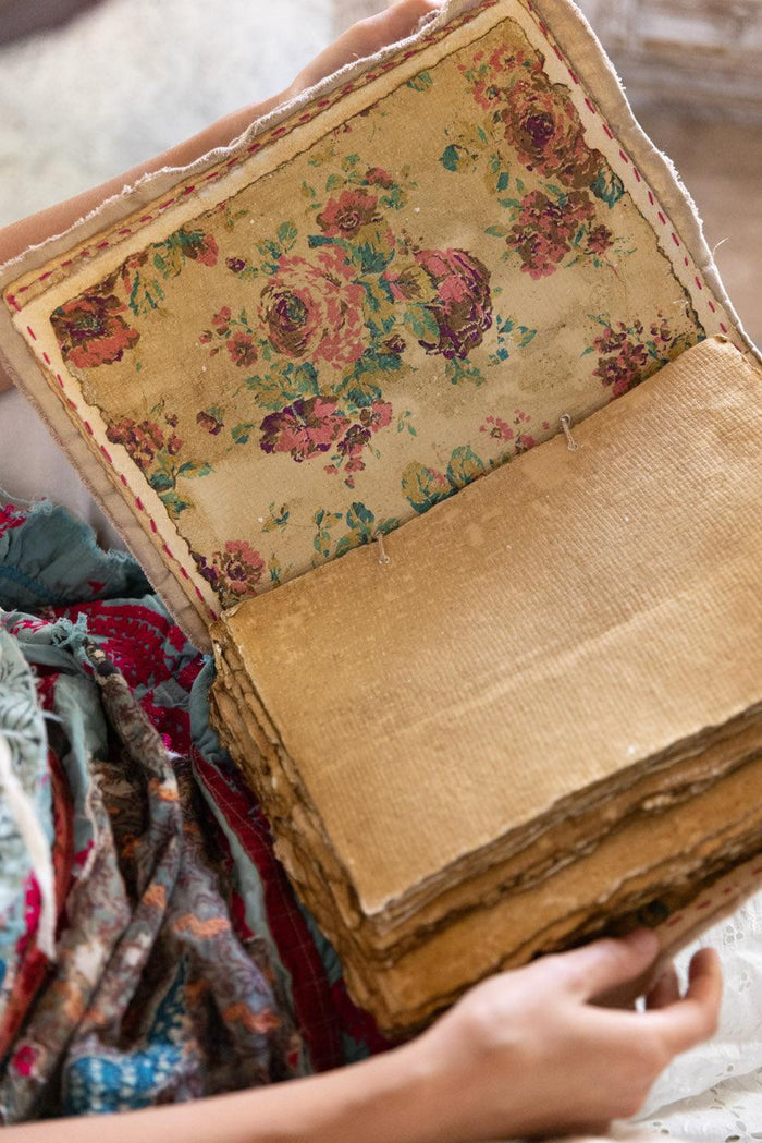 Vintage handmade book with floral fabric cover, rustic artisan style, Magnolia Pearl aesthetic
