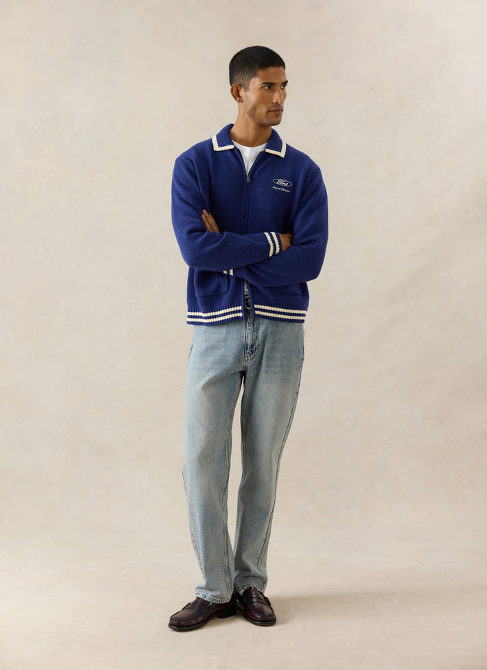 Cobalt blue Ford x Percival Gardner Knitted Zip Cardigan, styled with straight leg heritage denim jeans and dark loafers.