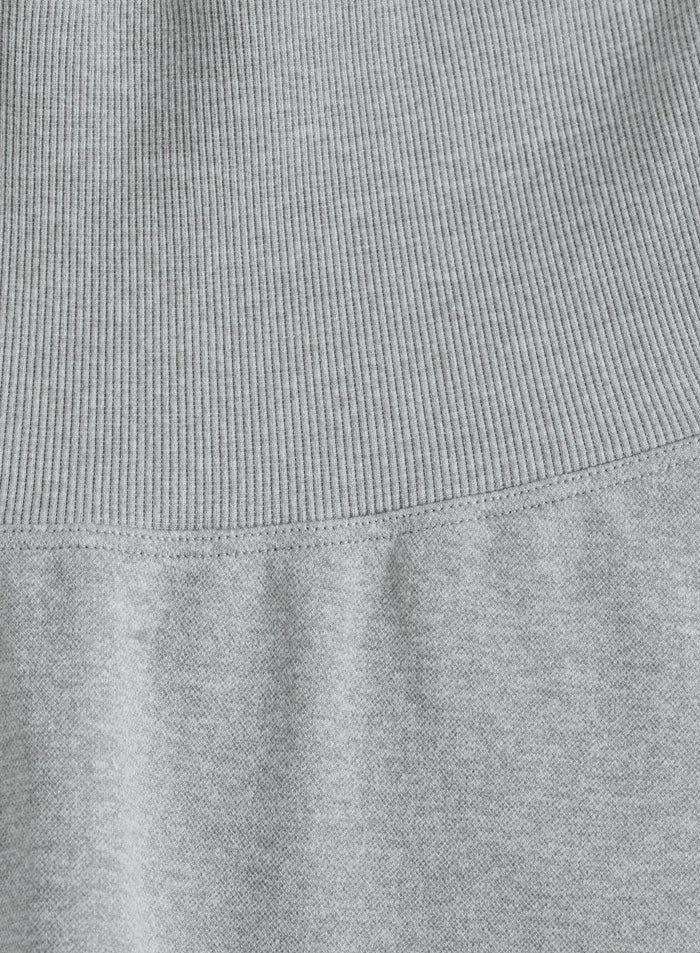 Grey melange fabric and high ribbed waistband on the aim'n Shape Seamless Tights.