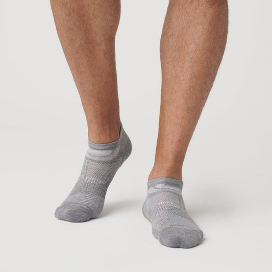 Heather Gray Ankle Sock Single on feet, showcasing seamless toe design.