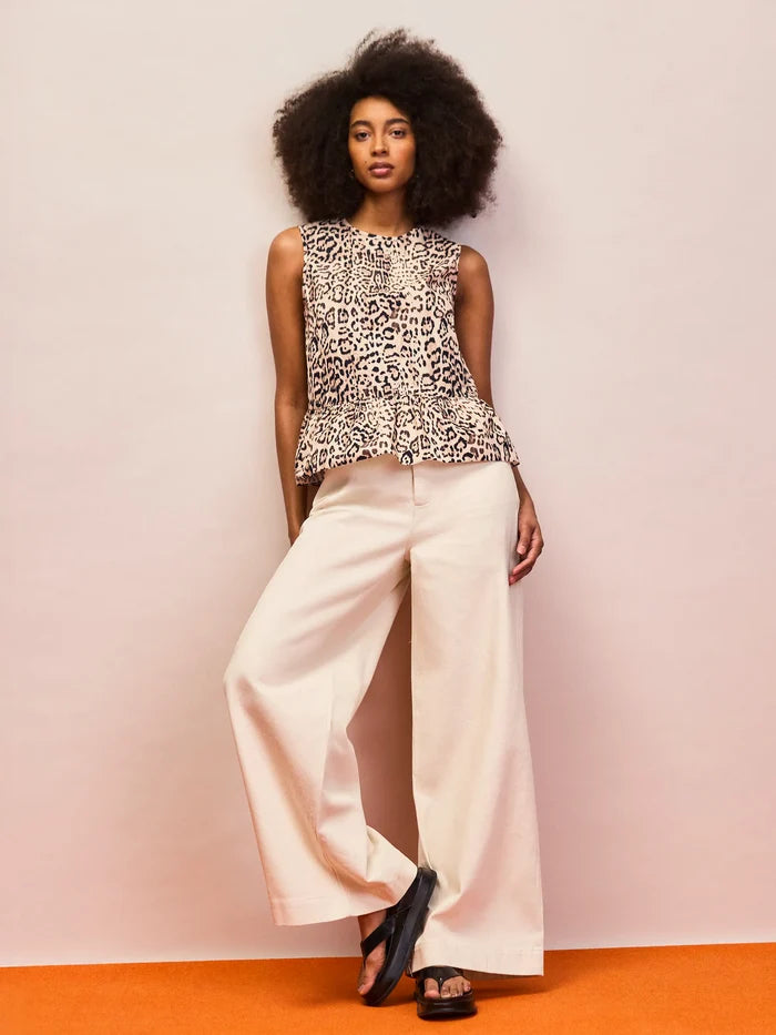 Neutral leopard print sleeveless cotton peplum top with feminine ruffle hem