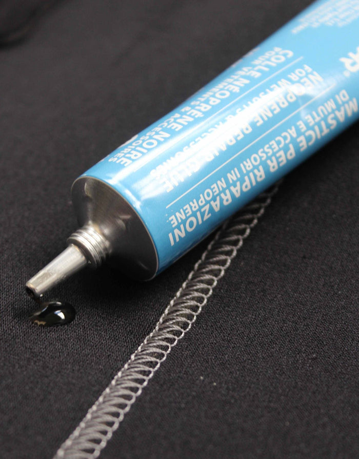Blue and white tube of Look Clear Neoprene Wetsuit repair glue with black nozzle