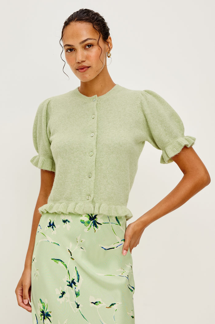 Lora Wool Cardigan With Crewneck Short Puff Sleeves and Hem With Ruffle Trim and Front Buttons in Julep Colorway - Upper Body Front View Featured on Model