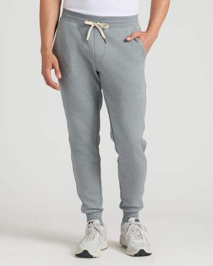 Tall Fleece French Terry Joggers with cuffed ankles, white sneakers visible.
