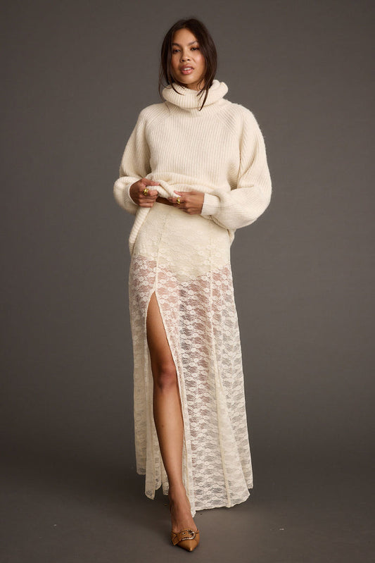 White lace maxi skirt with refined accents, a white lace skirt essential.