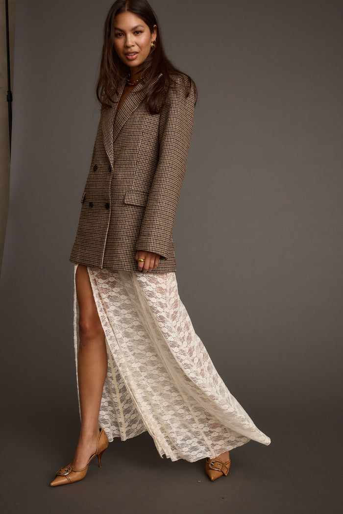 Lifestyle shot of the white maxi skirt styled for day-to-night versatility.