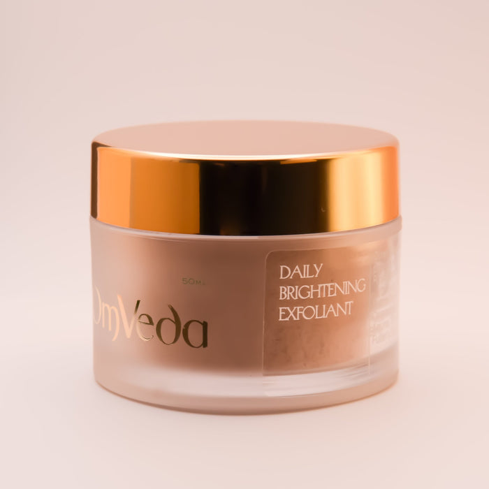 OmVeda daily brightening exfoliant jar, gold top, label text visible