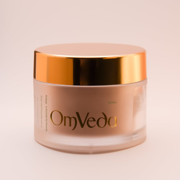 OmVeda daily brightening exfoliant jar front, gold lid