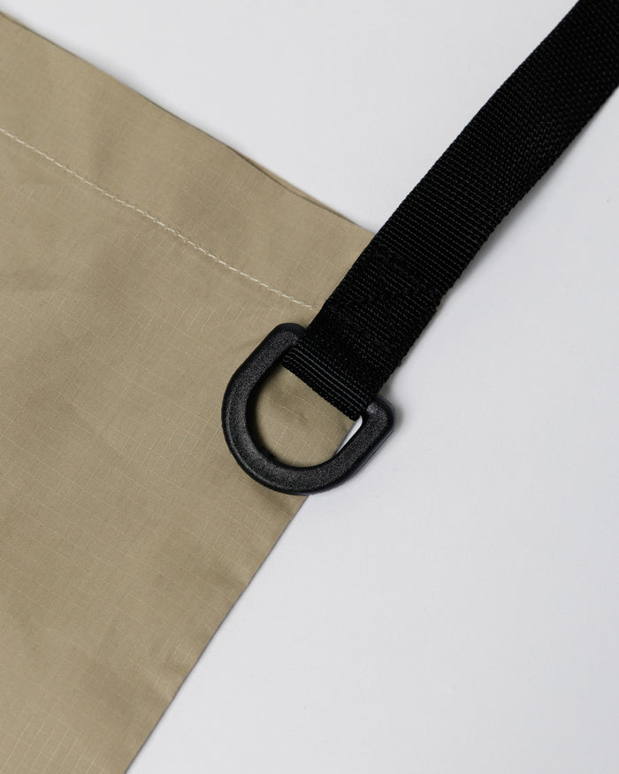 Outnback Musette in stone, D-ring strap attachment detail