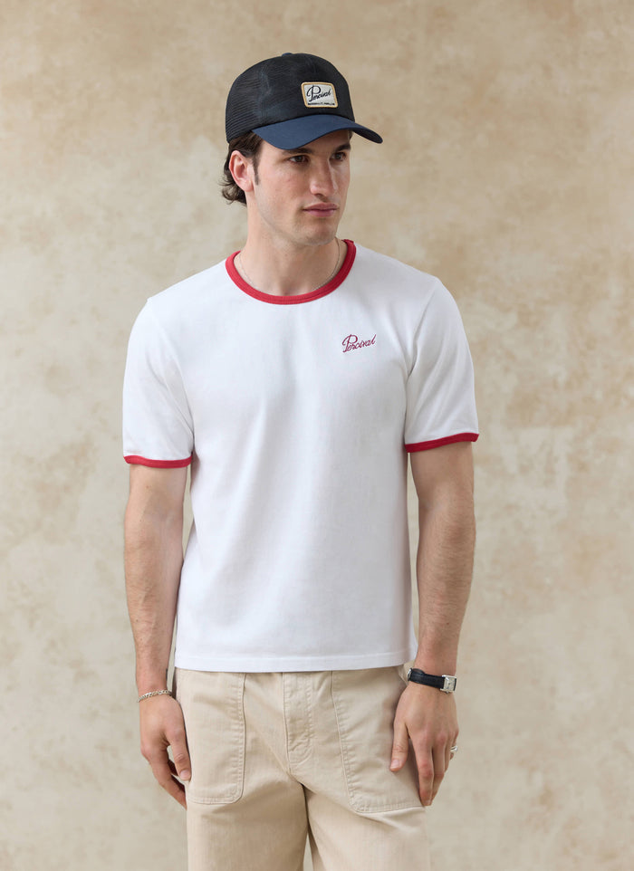Slim fit white Percival organic cotton ringer t-shirt with red trim; want more? check out our SS26 collection.