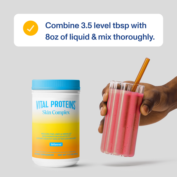 Container of Skin Complex - Unflavored | Vital Proteins beside a hand holding a glass of pink mixed drink with a straw, with instructions to mix 3.5 tablespoons with 8 ounces of liquid.