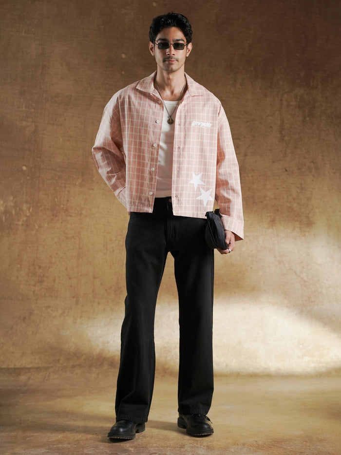 Chest branding detail on salmon plaid shirting - GROOVY Pakistan