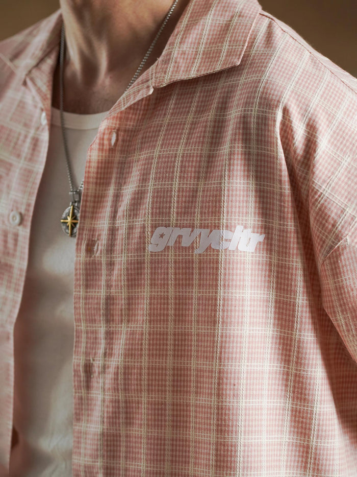 White star print detail on salmon plaid - GROOVY Pakistan