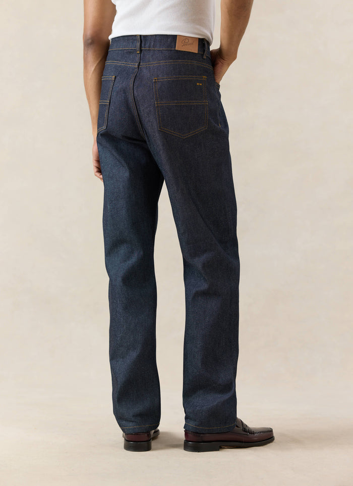 Percival Straight Leg Heritage Denim Jeans in raw indigo, showing the structured 14oz cotton fit and leather back patch.