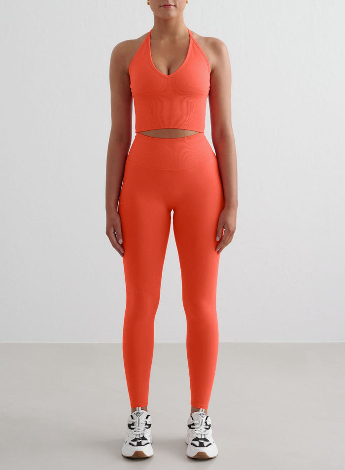 Tangerine aim'n Shape Seamless Cross Back Bralette with ribbed details and matching leggings for a second skin feel.
