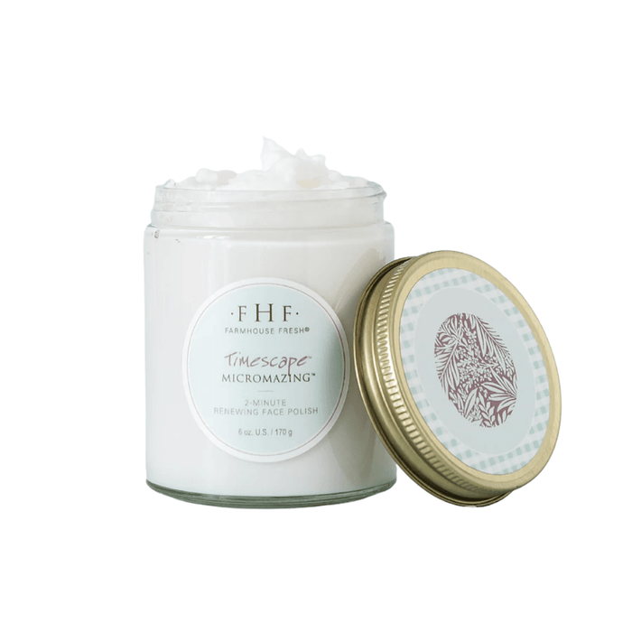 Open jar of Timescape™ Micromazing™ 2-Minute Renewing Face Polish | Farmhouse Fresh showing creamy white exfoliating skincare product with gold and patterned lid beside it.