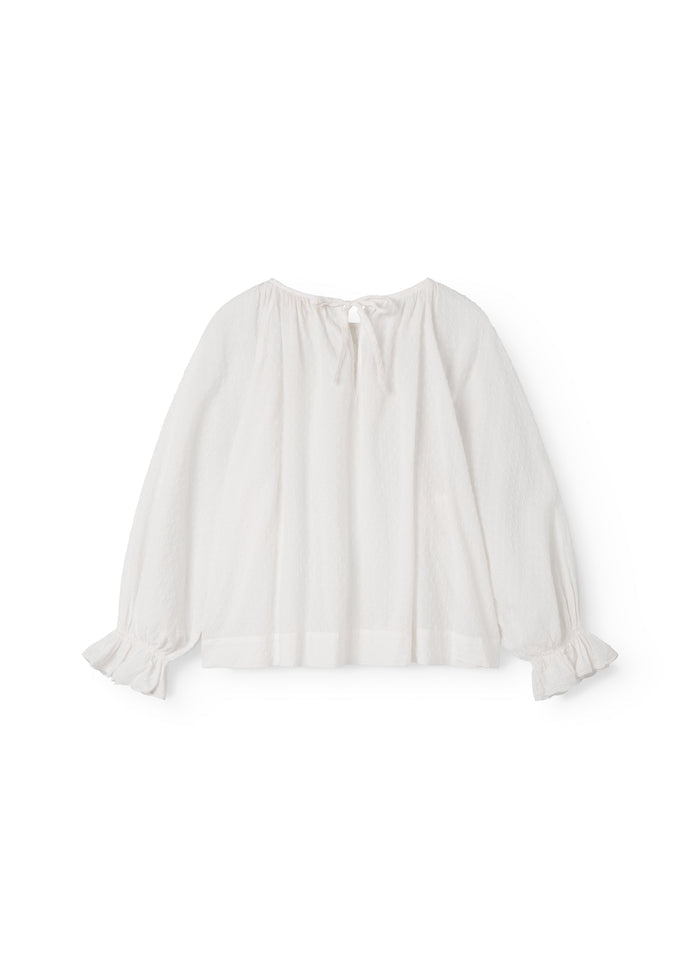Lang-sleeved blouse for women with embroidery pattern.