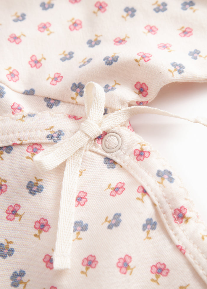 Fitted blouse for newborn baby with snap closure and floral print