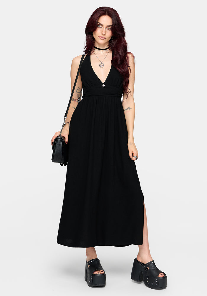 Woman wearing a black dress with a white background
