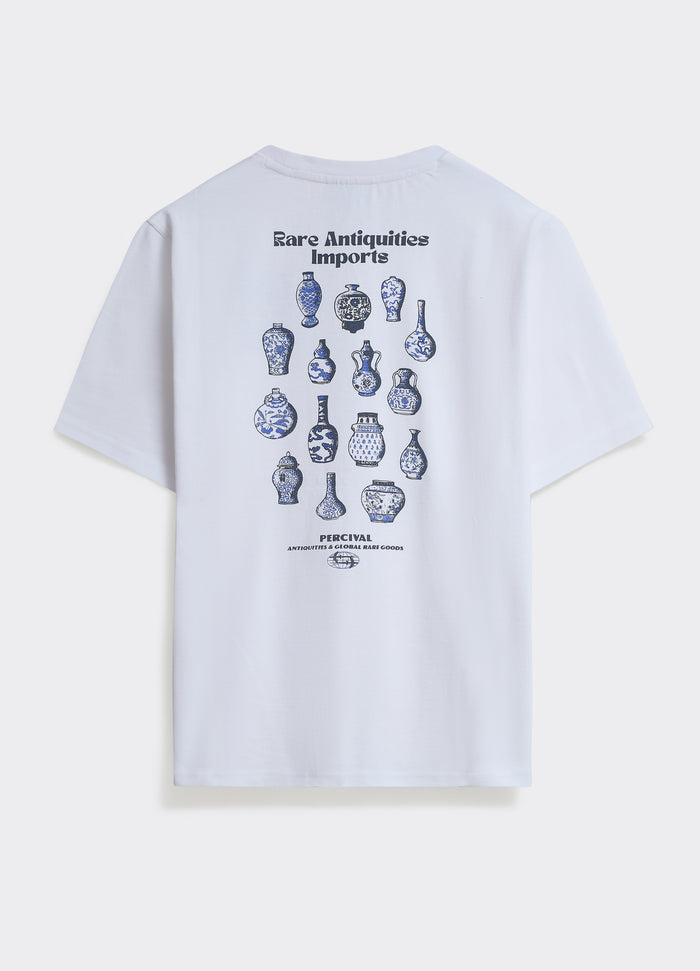The Percival Vase T-Shirt in optic white, featuring a blue ceramic back graphic and Rare Antiquities Imports branding.