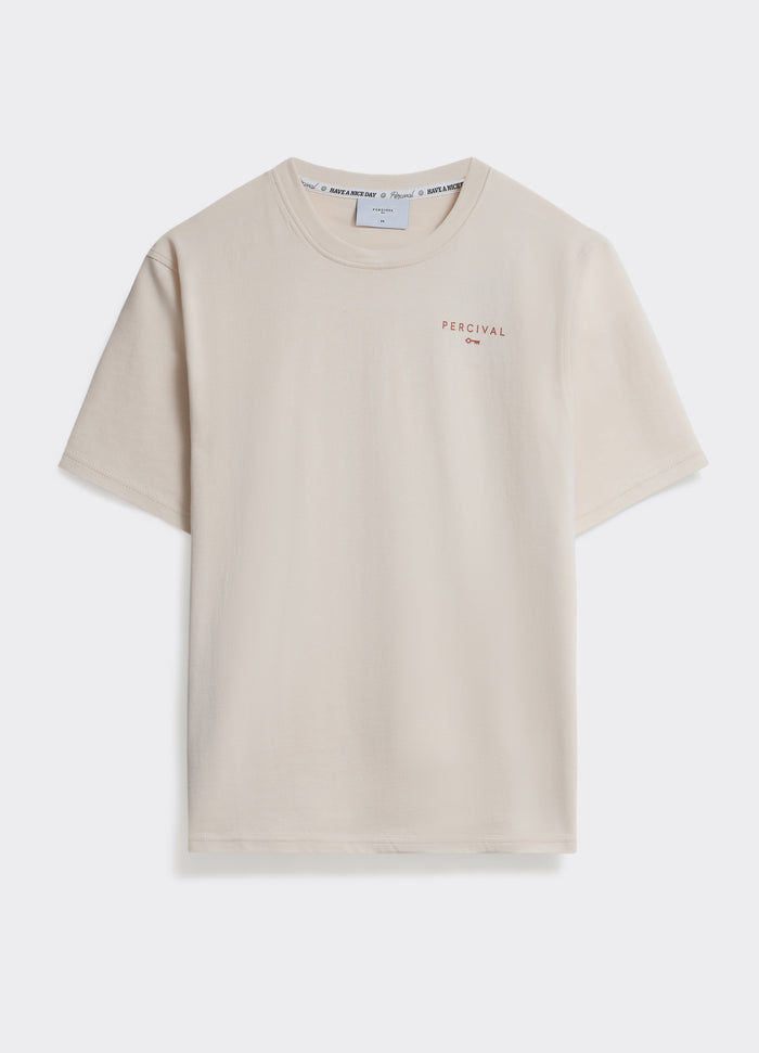 The Percival Waves T Shirt in off white, a soft jersey tee featuring a small chest logo, shown flat on a plain background.