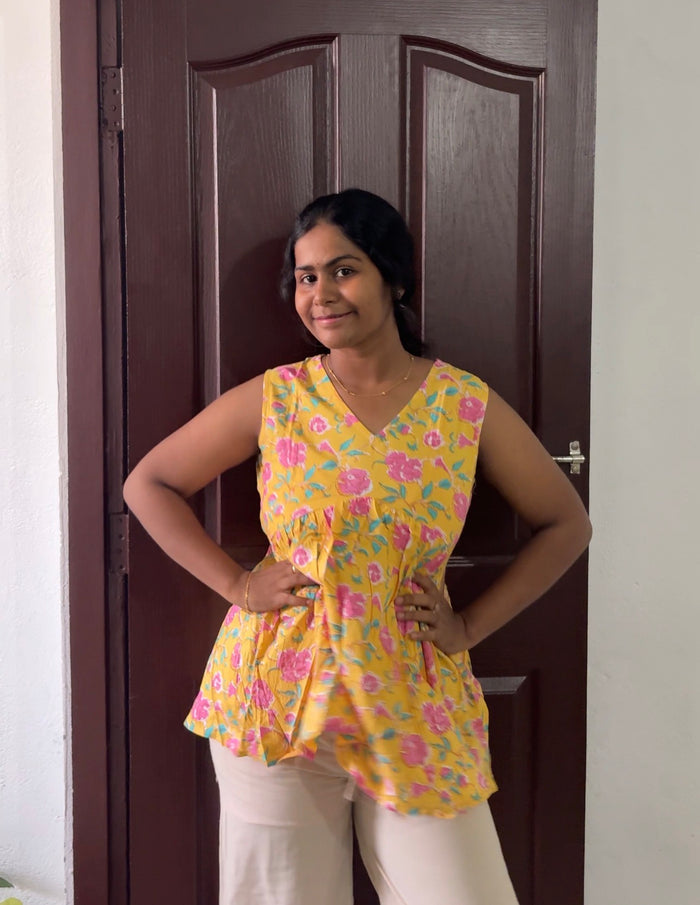 Yellow floral sleeveless Peplum Top