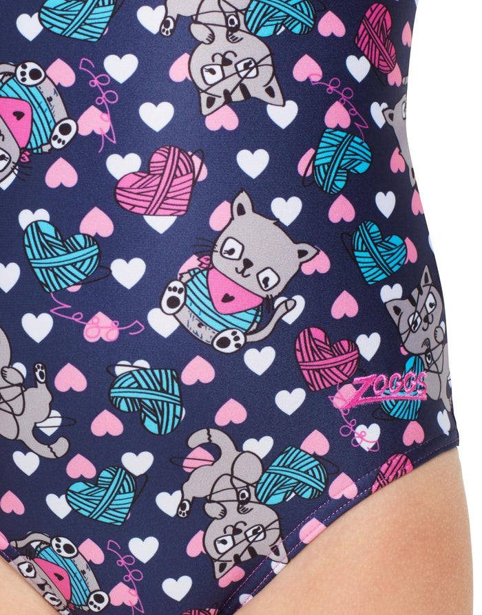 Zoggs Tots Girls Kitty Actionback swimsuit in navy blue with cat, yarn, and colorful hearts